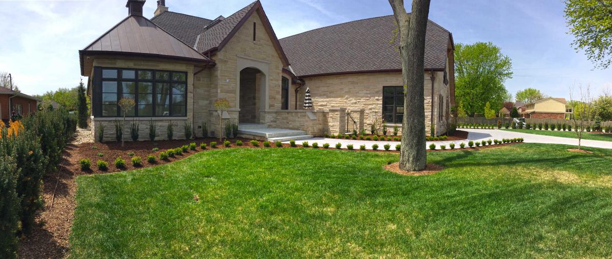 Residential mulch, shrubbery, and tree landscaping.