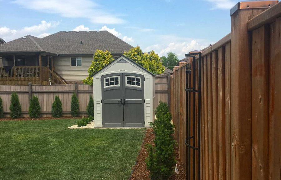 Shrub work in a residential backyard.